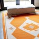 Hand Knotted Orange And Ivory Wool Rug